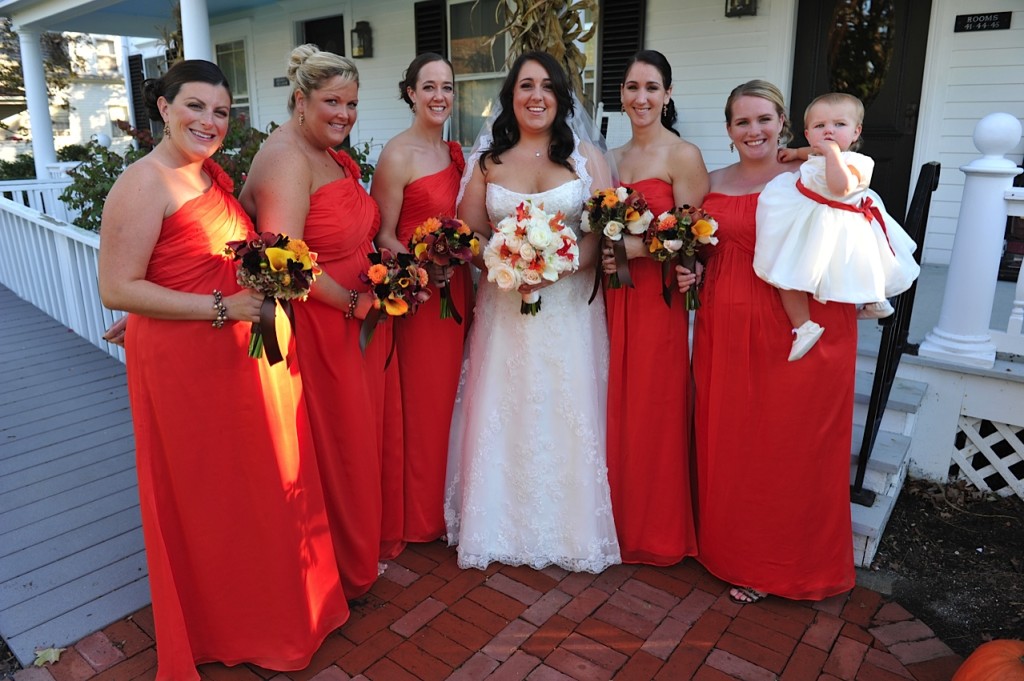 bridal party orange dresses autumn flowers publick house