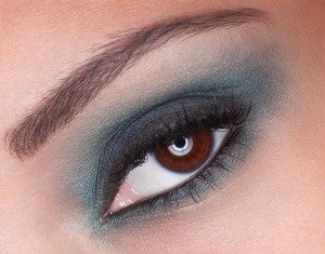 Close up of Afro-Am model's eye with teal smoky shadow